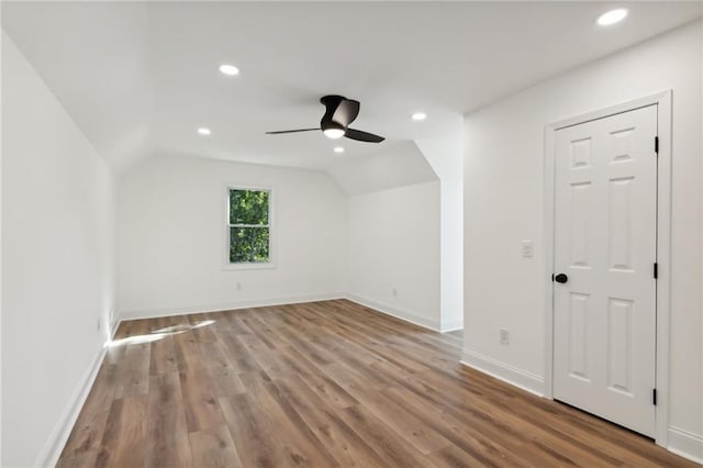 bonus room featuring ceiling fan, light wood-type flooring, and lofted ceiling