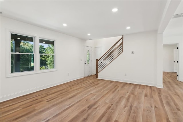 unfurnished living room with light hardwood / wood-style floors