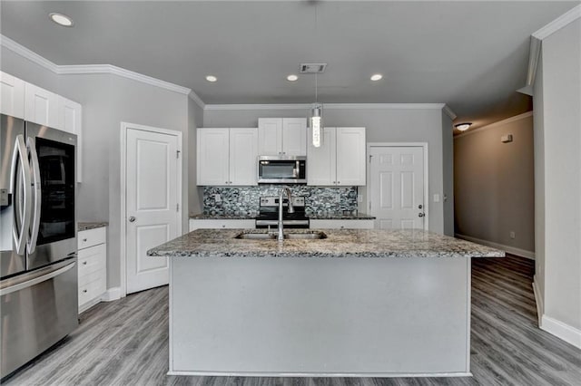 4421 Fulson Dr, Lilburn, GA 30047 - kitchen with appliances with stainless steel finishes, a sink, baseboards, light wood-type flooring, and crown molding