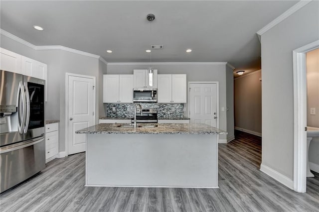 4421 Fulson Dr, Lilburn, GA 30047 - kitchen featuring appliances with stainless steel finishes, a sink, baseboards, light stone countertops, and light wood finished floors