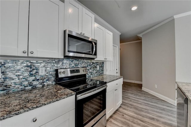 4421 Fulson Dr, Lilburn, GA 30047 - kitchen featuring stainless steel appliances, baseboards, light stone counters, backsplash, and crown molding