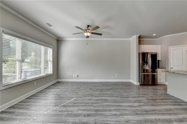 4421 Fulson Dr, Lilburn, GA 30047 - unfurnished living room featuring ceiling fan, ornamental molding, wood finished floors, baseboards, and recessed lighting
