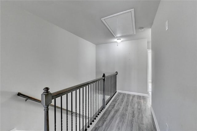 4421 Fulson Dr, Lilburn, GA 30047 - stairway featuring attic access, baseboards, and wood finished floors
