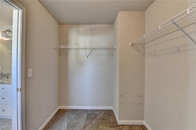 4421 Fulson Dr, Lilburn, GA 30047 - spacious closet featuring carpet floors