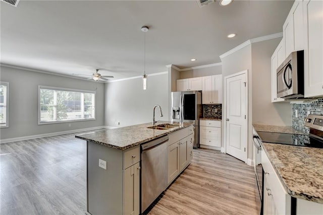 4421 Fulson Dr, Lilburn, GA 30047 - kitchen featuring appliances with stainless steel finishes, a sink, ornamental molding, light wood-style floors, and ceiling fan