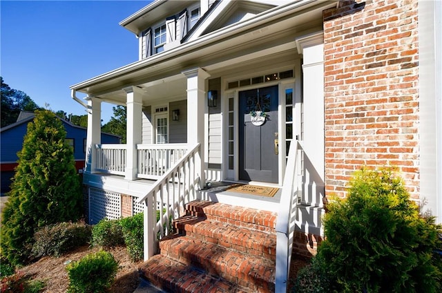 entrance to property featuring a porch