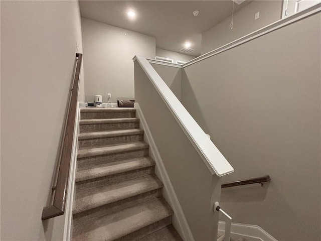 stairs featuring recessed lighting, visible vents, and baseboards