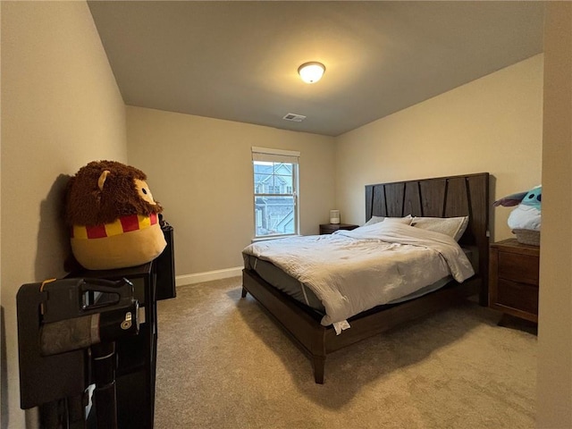 carpeted bedroom featuring visible vents and baseboards