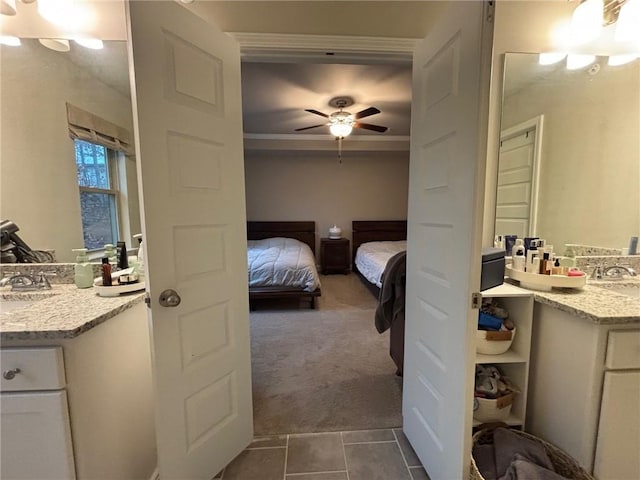 bathroom with tile patterned floors, vanity, ceiling fan, and ensuite bathroom