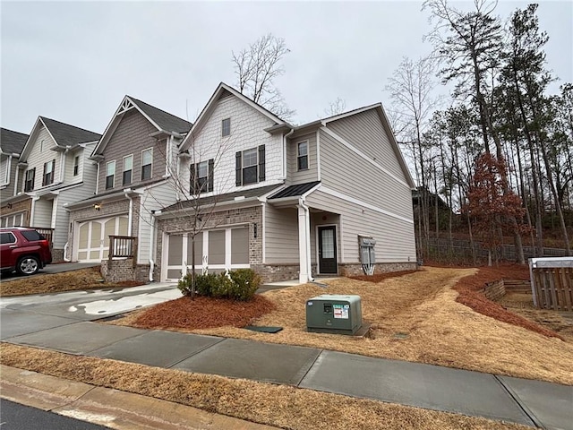 view of front of home with concrete driveway and an attached garage