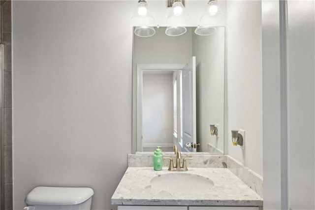 bathroom with vanity and toilet