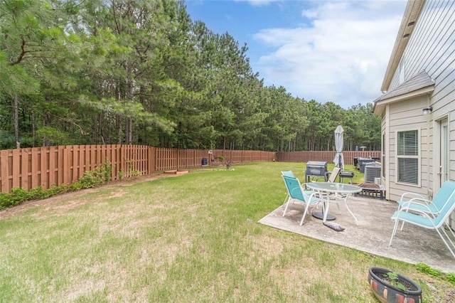 fenced backyard with a patio area