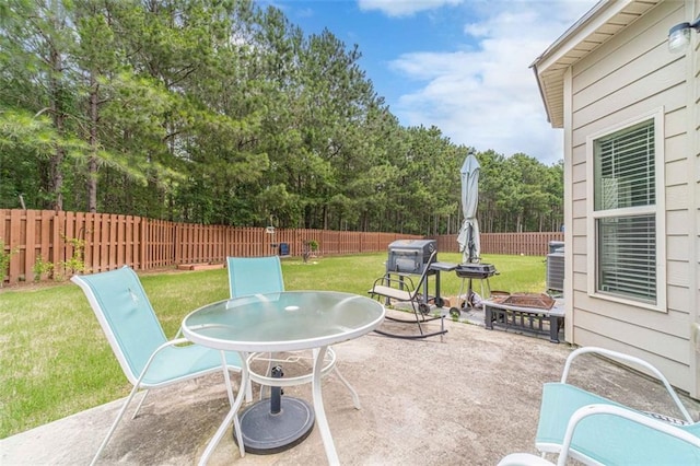 fenced backyard featuring a patio area and outdoor dining area
