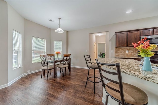 dining room featuring dark wood-style floors and recessed lighting