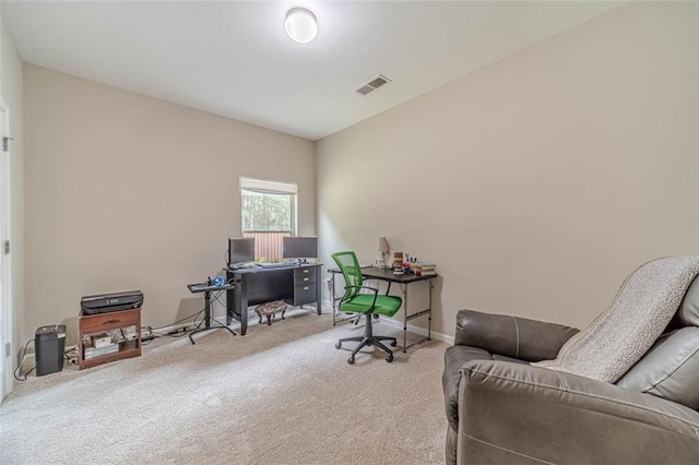carpeted home office with baseboards