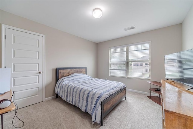 carpeted bedroom with baseboards