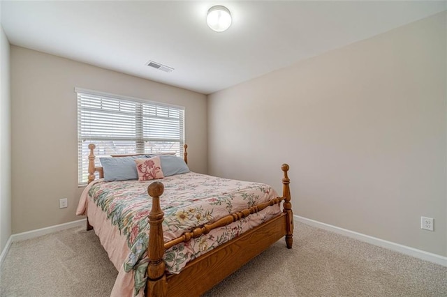 carpeted bedroom with baseboards