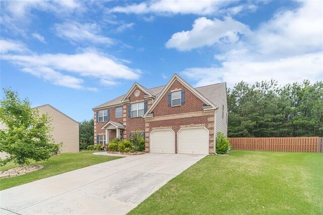 view of front of house featuring brick siding, an attached garage, and driveway