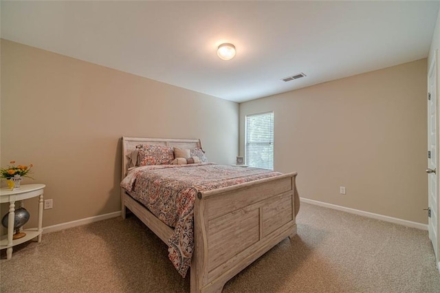 bedroom featuring light colored carpet