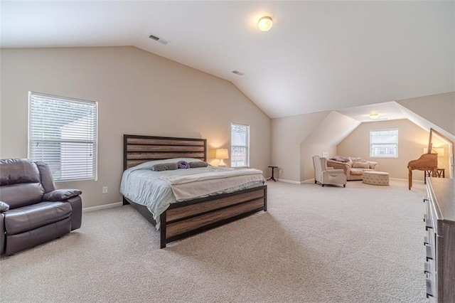 bedroom featuring vaulted ceiling and carpet