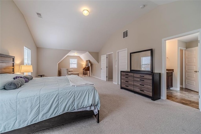 carpeted bedroom featuring vaulted ceiling