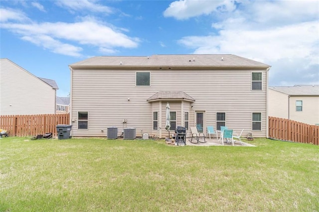 back of house featuring a patio area and a fenced backyard