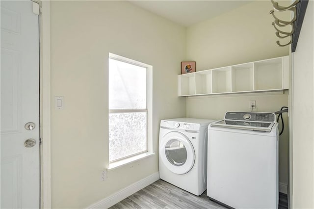 washroom featuring light hardwood / wood-style floors and independent washer and dryer