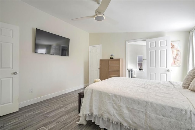 bedroom with ceiling fan, dark hardwood / wood-style floors, and lofted ceiling