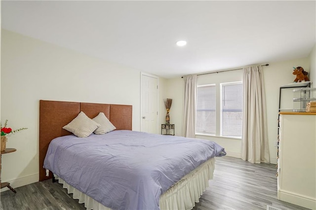 bedroom with wood-type flooring