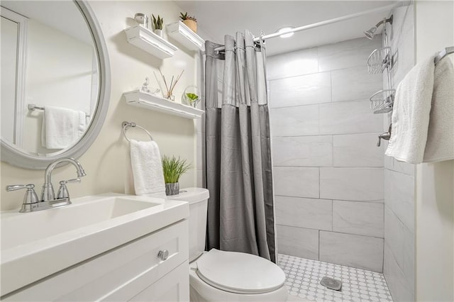 bathroom with toilet, vanity, and curtained shower