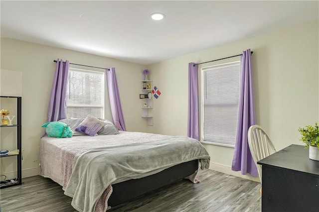 bedroom with hardwood / wood-style flooring