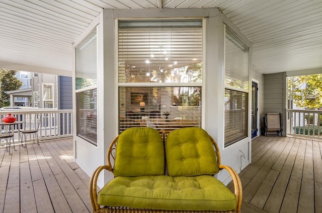 wooden terrace featuring covered porch