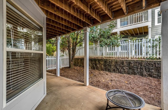 view of patio featuring fence