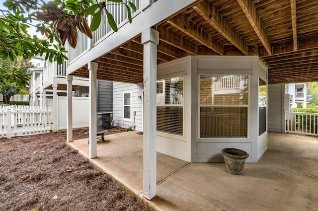 view of patio / terrace with cooling unit and fence