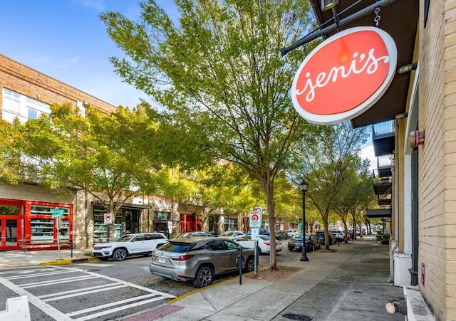 exterior space with traffic signs, sidewalks, and street lights