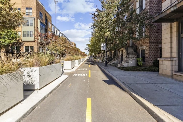 view of street featuring curbs and sidewalks