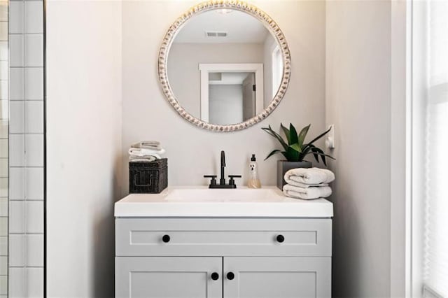 bathroom featuring vanity and visible vents