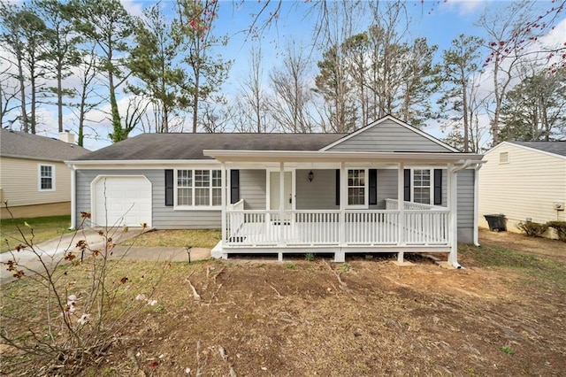 ranch-style house with a garage, covered porch, and concrete driveway