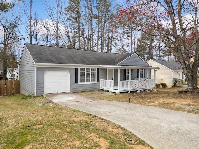 ranch-style home featuring fence, driveway, a porch, a front lawn, and a garage