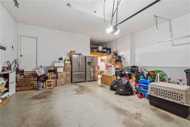 310 Arbor Creek Trl, Roswell, GA 30076 - garage featuring stainless steel fridge with ice dispenser and a garage door opener