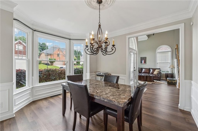 310 Arbor Creek Trl, Roswell, GA 30076 - dining area featuring a chandelier, a decorative wall, crown molding, a wainscoted wall, and dark wood-style flooring