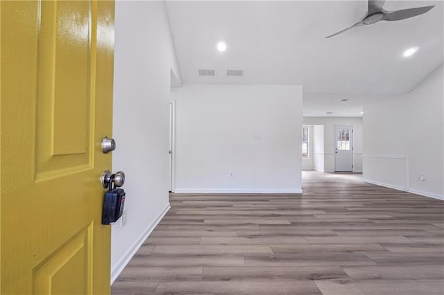 interior space featuring wood-type flooring and ceiling fan