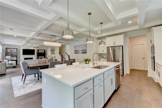 8305 Beryl Overlook, Gainesville, GA 30506 - kitchen featuring a sink, coffered ceiling, beamed ceiling, light countertops, and stainless steel appliances