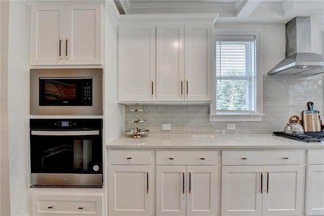 8305 Beryl Overlook, Gainesville, GA 30506 - kitchen featuring appliances with stainless steel finishes, wall chimney range hood, ornamental molding, white cabinets, and light countertops
