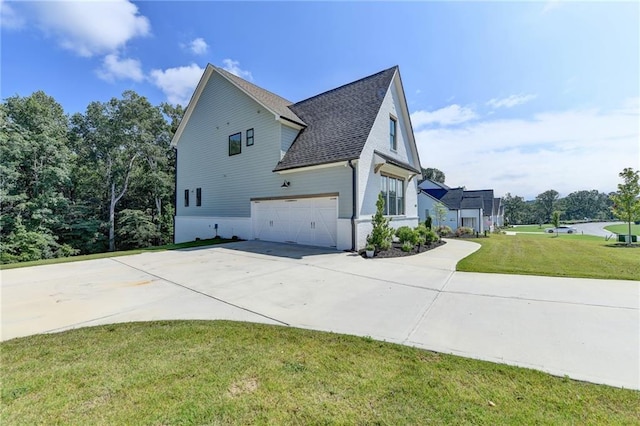 8305 Beryl Overlook, Gainesville, GA 30506 - view of side of property with driveway, an attached garage, a shingled roof, and a yard