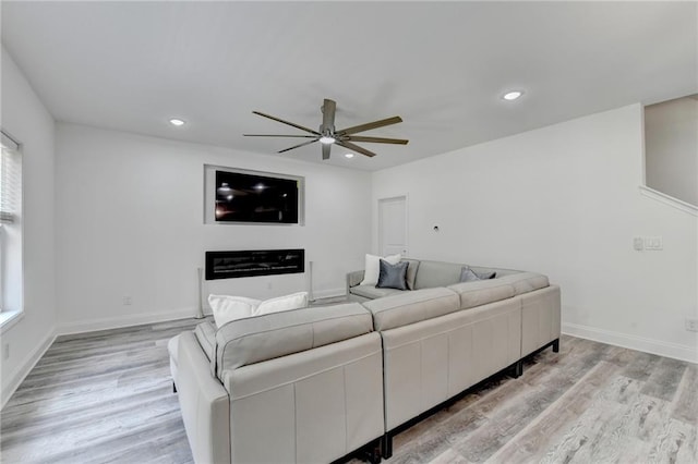 8305 Beryl Overlook, Gainesville, GA 30506 - living area featuring a ceiling fan, light wood-style floors, healthy amount of natural light, and recessed lighting
