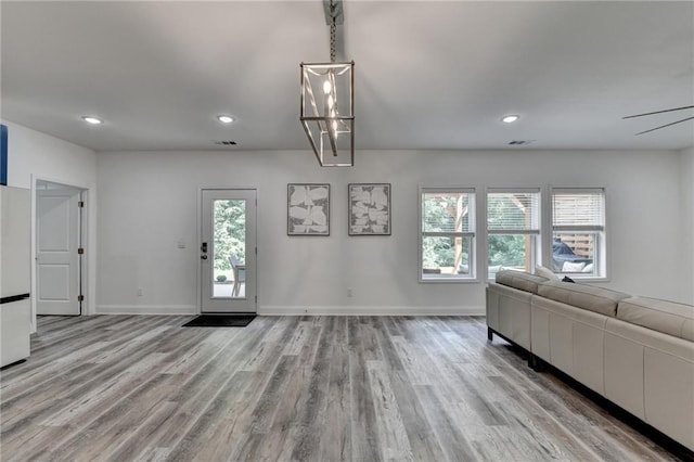8305 Beryl Overlook, Gainesville, GA 30506 - living area featuring light wood-type flooring, healthy amount of natural light, recessed lighting, and baseboards