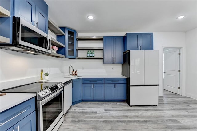 8305 Beryl Overlook, Gainesville, GA 30506 - kitchen featuring appliances with stainless steel finishes, open shelves, blue cabinetry, light wood finished floors, and light countertops