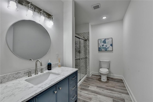 8305 Beryl Overlook, Gainesville, GA 30506 - full bath with vanity, toilet, a shower stall, wood finished floors, and recessed lighting