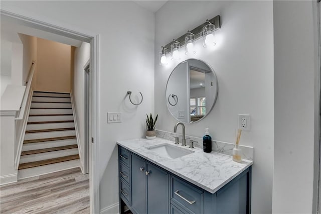 8305 Beryl Overlook, Gainesville, GA 30506 - bathroom featuring vanity, wood finished floors, and baseboards